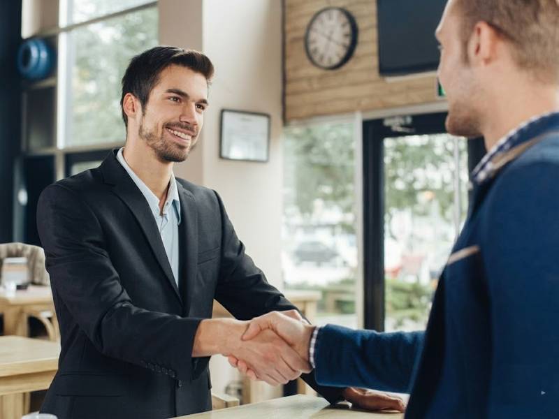 Property manager and happy tenant shaking hands after solving bed bug problem